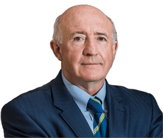 A color photographic cutout of Dermot Moran wearing a blue sports coat and powder blue shirt and blue and green striped tie used to visually identify him.