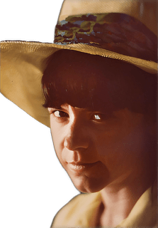 An enhanced and colorized headshot of a young Margaret Dauler Wilson wearing a yellow wide brimmed summer hat used for visually  identifying her.