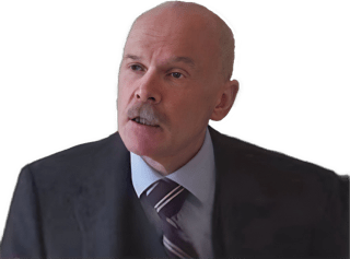 A reversed enhanced color photographic headshot and upper torso cutout of a mustached Theo Verbeek with his head turned to his right wearing a dark suit jacket, white shirt, and blue and white striped tie used for visually identifying him.
