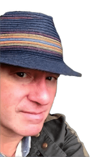 A reversed enhanced colorized photographic headshot cutout of Ray Scott Perceival wearing a dark blue hat with colorful headbands and an outerwear jacket used to visually identify him.