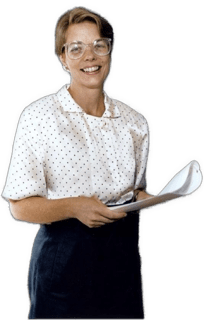 An enhanced colorized from waist up photographic cutout of a smiling and glasses adorned Nancy L. Maull wearing white blouse and  dark blue skirt while holding some white papers in her hands at waist level used to visually identify her.
