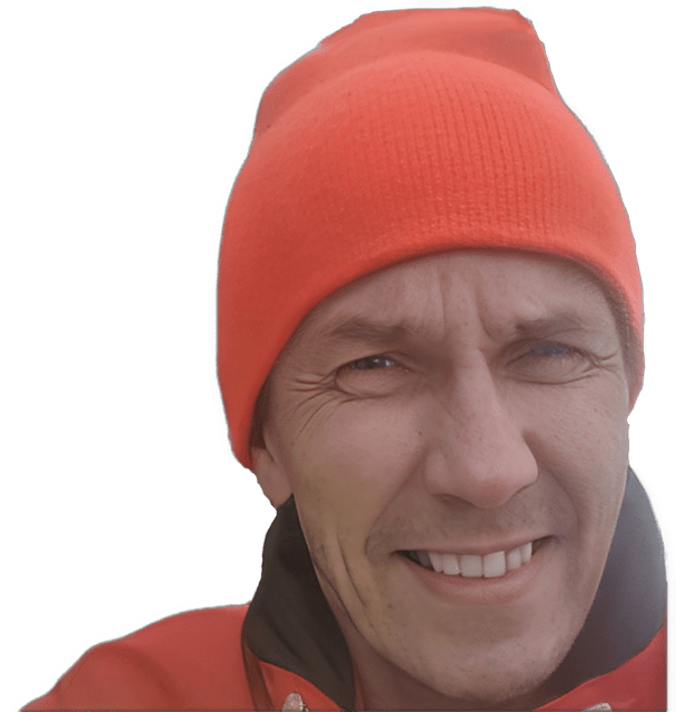 A reversed enhanced color closeup photographic cutout headshot of Arto Repo wearing an orange pull cap and orange jacket with dark collar used to visually identify him.