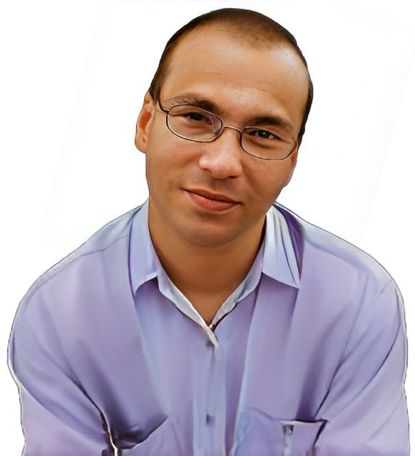 A reversed enhanced color photographic upper torso and headshot cutout of Predrag Milidrag as a young man with glasses and his head tilted to his left shoulder wearing a purple collared shirt used to visually identify him.