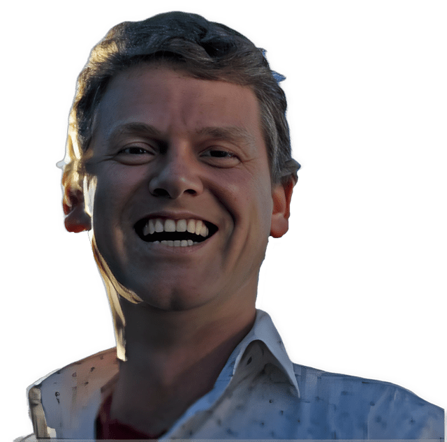 An enhanced color photographic headshot cutout of a smiling with an open mouth John Sutton wearing an open collared white shirt with patterned speckles on it used to visually identify him.