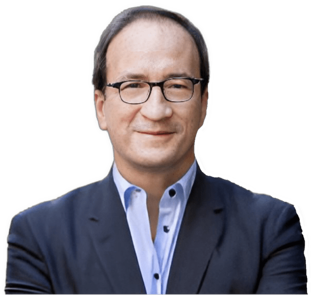 A reversed enhanced color photographic headshot cutout of Martin Pickavé with glasses and wearing a light purple shirt under a dark blue jacket is used for visual identification.