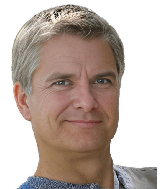 An enhanced colorized photographic headshot cutout of Lawrence Nolan wearing a blue shirt is used for visual identification.