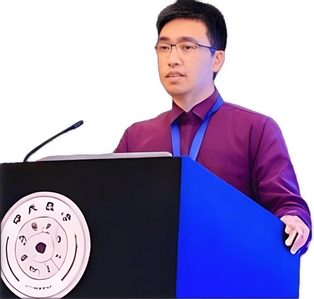 An enhanced color photographic cutout of Weite Zhang wearing glasses and a maroon shirt, lecturing while standing behind a black front and blue-sided podium is used for visual identification.
