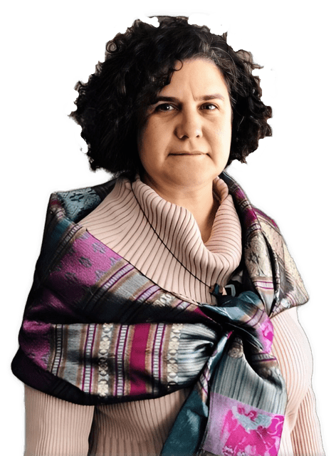 An enhanced photographic upper torso and headshot cutout of Lisa Shapiro, with big hair and wearing a salmon-colored floppy turtleneck sweater under a colorful shawl tied at her chest, is used to identify her visually.