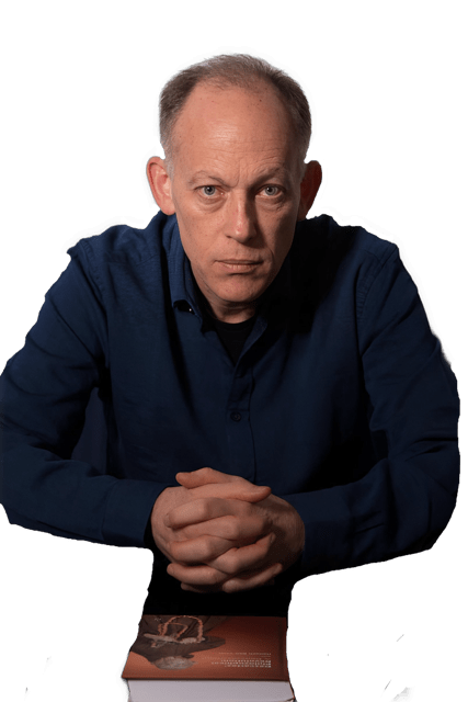 An enhanced color photographic headshot cutout of Hanoch Ben-Yami, with a stern expression on his face, seated with his fingers interlocked and resting on his book, is used for visual identification.