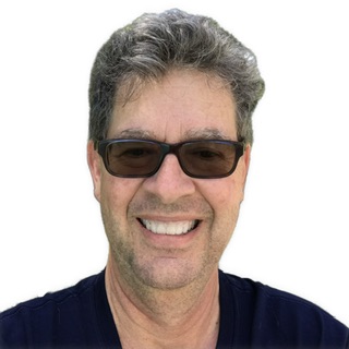 A photographic cutout of a smiling Dr. David C. Ring, wearing dark glasses and a black shirt from the shoulders up, is used for visual identification.