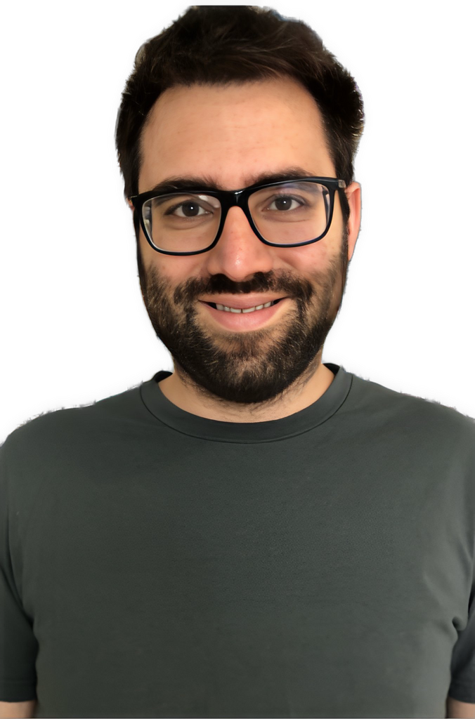 An enhanced color photographic headshot cutout of Sebastian Bender, with a slightly open-mouthed smile, black beard and mustache, black-framed glasses, and a rounded-neck dark gray shirt, is used for visual identification.